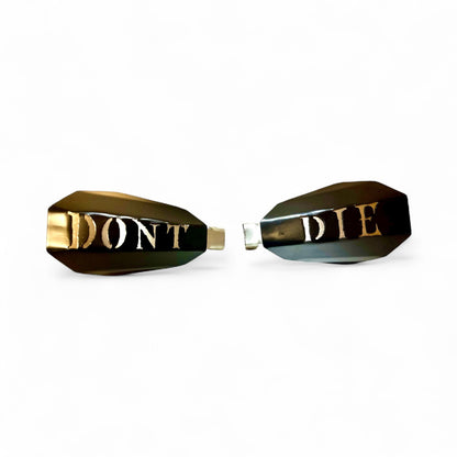 Motorcycle hand guards with the saying "Don't Die" cut into the black powder-coated outer shell bolted to a chrome powder coated mount.