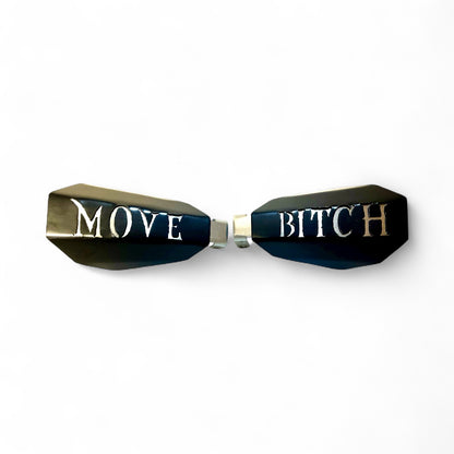Motorcycle hand guards with the saying "Move Bitch" cut into the black powder-coated outer shell bolted to a chrome powder coated mount.