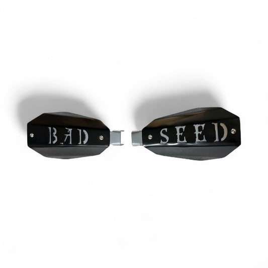 Bad ass mototcycle hand guards with the saying "bad Seed" cut into the black powder-coated outer shell bolted to a chrome powdercoated mount.